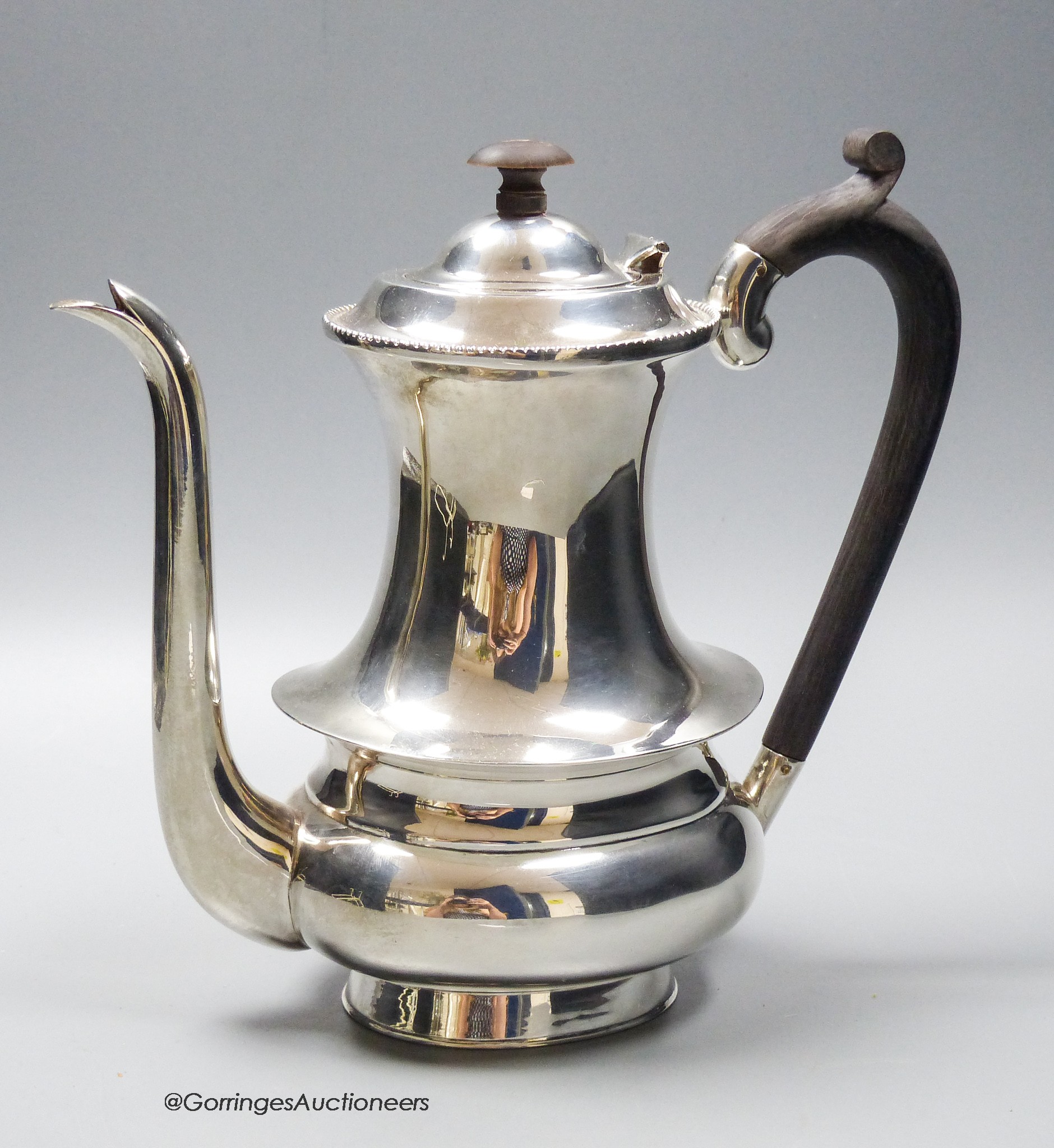 A white metal (stamped sterling silver) coffee pot, height 22cm, gross weight 26.5oz.